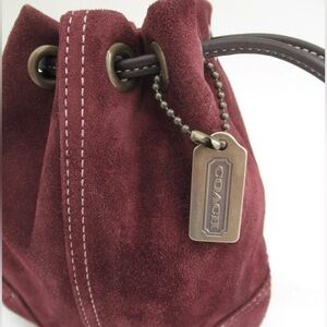 COACH Suede wristlet with leather drawstring closure 👛